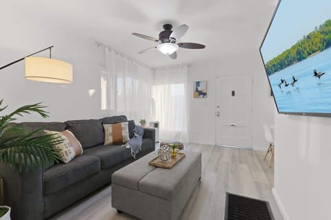 Bright, cozy, and inviting—this stylish living space is the perfect place to relax and unwind.