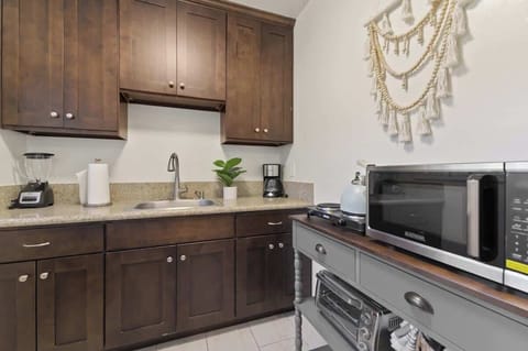 Cozy and functional kitchen with rich wooden cabinets and modern appliances.