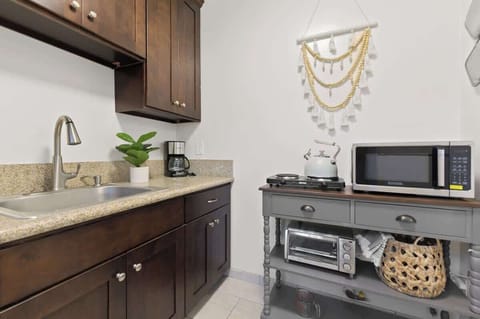Cozy and functional kitchen with rich wooden cabinets and modern appliances.