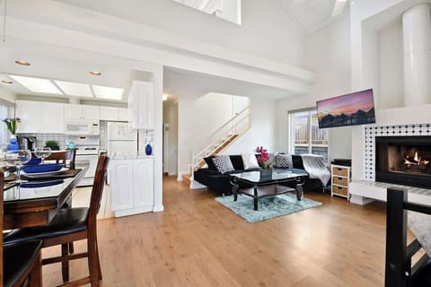 The open spaced living room with vaulted ceiling creates a perfect space for family and friends to gather and create memories