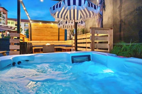 relax in the Jacuzzi near the firepit outside 