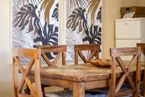 Charming dining area with rustic wooden table – perfect for shared meals and conversation.