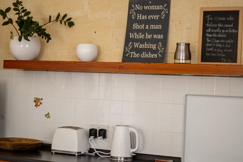 Fully equipped kitchen with modern appliances and thoughtful touches for a comfortable stay.