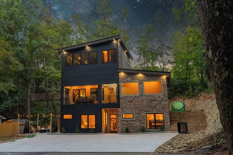 Stunning modern cabin exterior surrounded by peaceful forest views