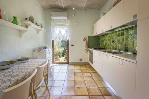 Interior Design, Flooring, Floor, Kitchen, Furniture, Countertop, Ceiling, Room, Major Appliance, Lighting