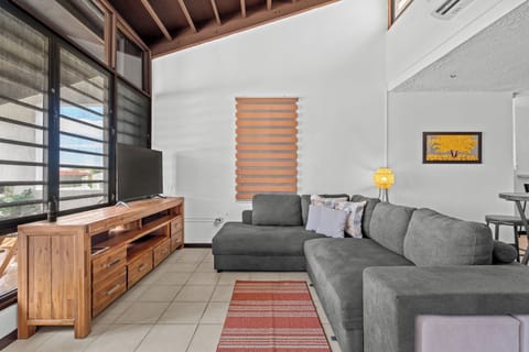 Feel at home in our cozy living space, complete with a comfy sofa, modern TV setup, and plenty of natural light for a serene ambiance.