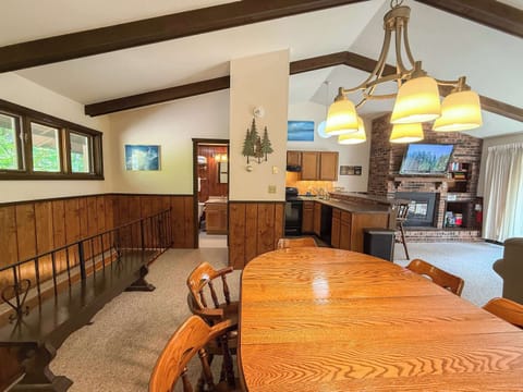 View from the dining room table to the kitchen and bathroom.