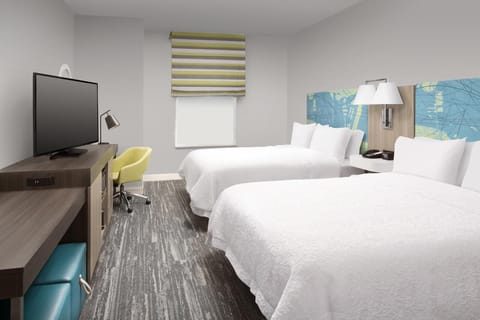 Unwind in crisp beds and a bright, modern room.