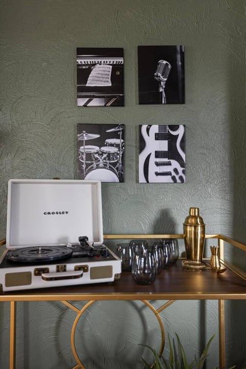 A record player and bar cart brings in all the music vibes!