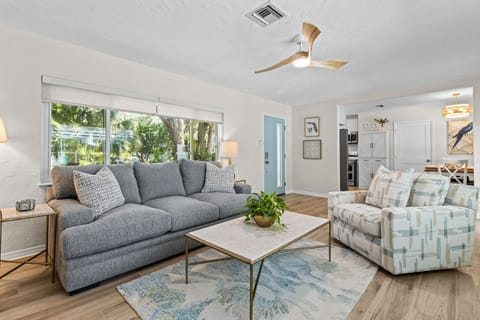 Main House: Livingroom with view of pool and sofa bed.