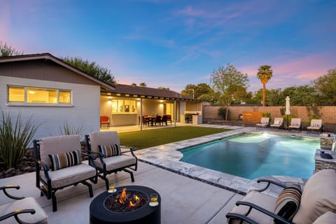Relax by the fire pit and enjoy the stunning sunset over the pool.