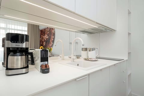 The fully equipped kitchenette includes everything you need for a home-cooked meal.