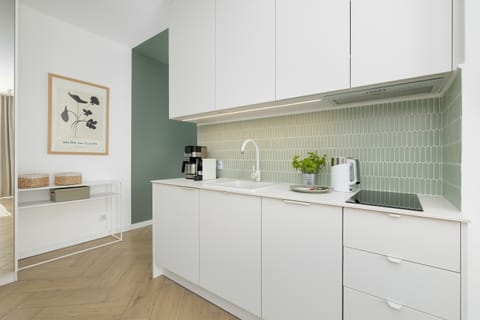 The fully equipped kitchenette includes everything you need for a home-cooked meal.