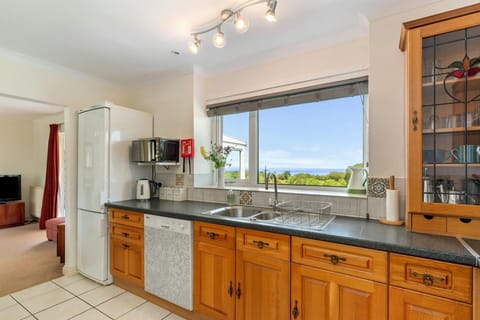 Kitchen with large window and sea views