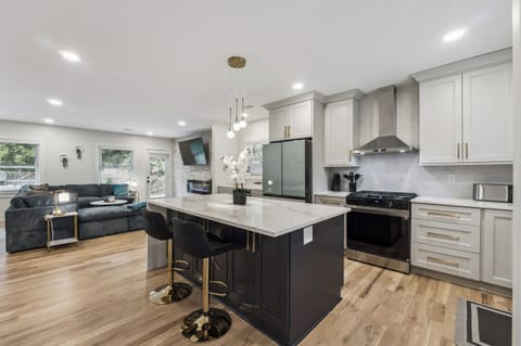 New full Kitchen w/ island, stainless-steel appliances, wine cooler