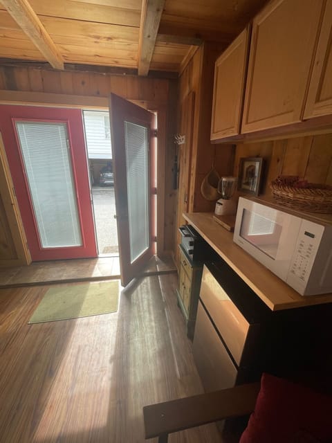 Kitchenette - microwave, fridge, blender, toaster oven, and front door