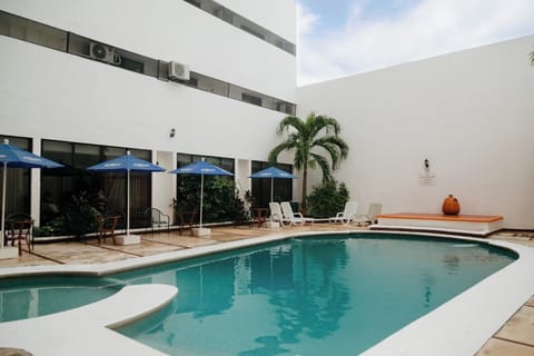 Stretch out on loungers and enjoy a refreshing swim.