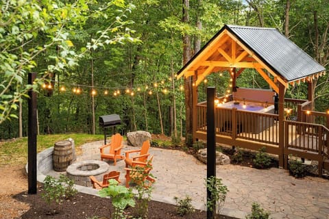 Your private oasis awaits—relax by the fire or soak in the hot tub amid nature.
