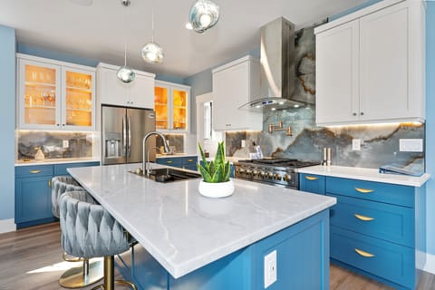 Kitchen includes large marble counter top with seating for two | Main Level