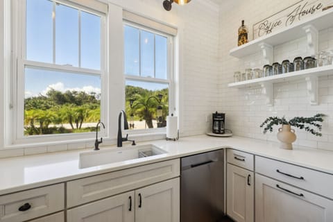 Full kitchen with stainless steel appliances including a gas 5-burner stove top and oven, refrigerator, drawer microwave, dishwasher, reverse osmosis water system, standard drip coffee maker, Nespresso machine, toaster, blender, crock pot, and fully stocked with all kitchen essentials.