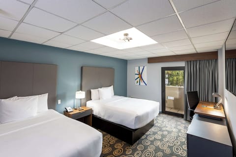 Sleep soundly with two plush beds and calming blue tones.
