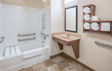 Refresh easily in a bright bath with accessible tub rails.