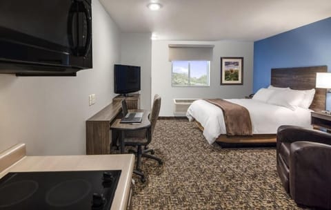 Stretch out in a spacious king room with cozy chair.