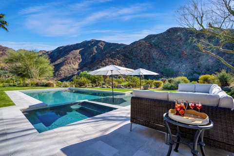Expansive pool featuring a charming landscape.