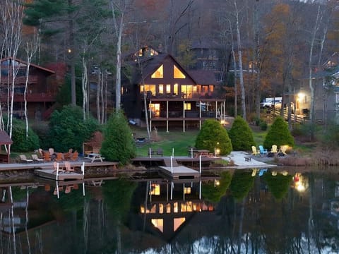 Lakefront cabin/chalet with incredible, expansive views, private beach, dock, many water toys, lakeside fire pit, hot tub, multiple game rooms