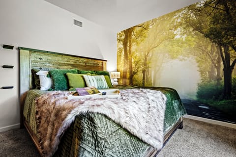 Bedroom Suite 2 features stunning views, custom wallpaper, a 55' Smart Tv and a Keurig coffee maker for a cozy morning in