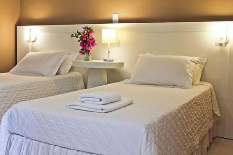 Unwind into crisp twin beds after a relaxing day out.