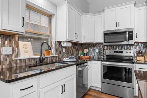 The open kitchen offers ample space & all the comforts of home​