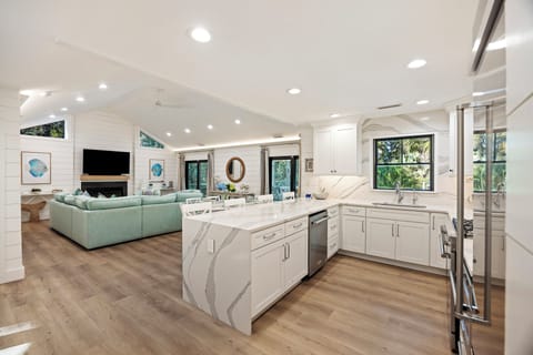 Fully equipped kitchen with bar stools for extra seating