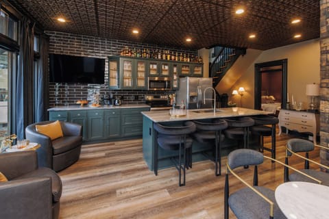 Exposed stone walls add a rustic and historic touch to the home.