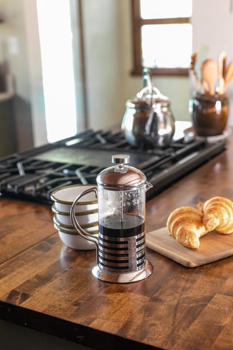 The morning starts slow and peaceful with a French press on the table, filling the room with the rich aroma of fresh coffee.