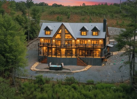 Dusk shot of the High River Lodge, an ultra-luxury, family-sized cabin rental in North Georgia 