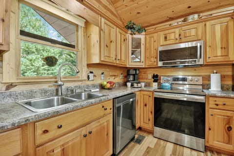 Pet-friendly, fully stocked, and cozy, this Ellijay cabin blends comfort with style