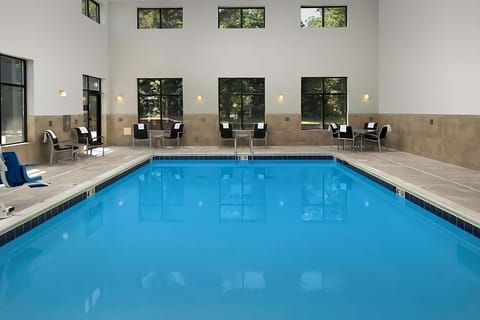 Dive into a sunlit indoor pool for refreshing laps.