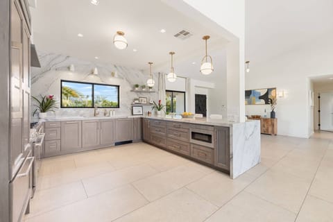 Well equipped kitchen with ample cupboard and counter space