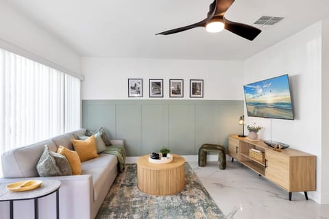 Living room features a generously sized Roku smart TV.