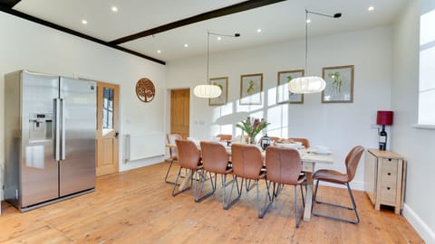 The generous kitchen has space to sit all 20 guests across the 10-seater dining table and additional folding table.