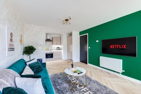 A spacious open-plan living and dining area, complete with a 55” Smart TV for your entertainment and relaxation