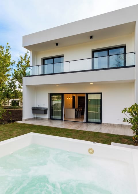 Relax and unwind in your very own jacuzzi surrounded by tropical greenery.