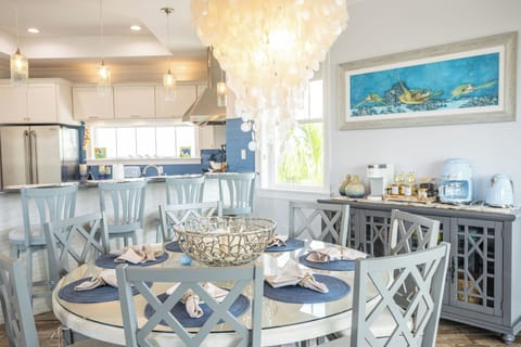 Fully-stocked chef's kitchen and dining space with gourmet coffee bar