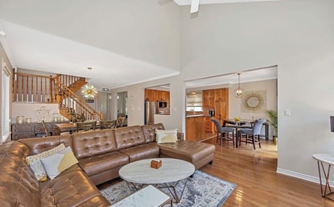 Spacious living area with fire place and access to large patio