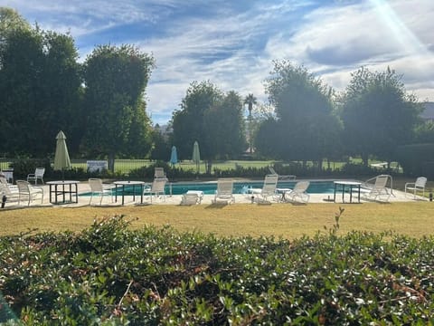 View of Pool from patio hot tub is to the left off photo.