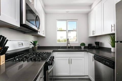 Cook your favorite meals with ease in a sleek, modern kitchen