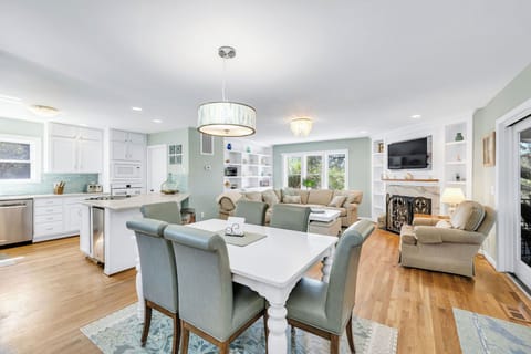Open floor plan on lower level of home. Dining table comfortably seats six.