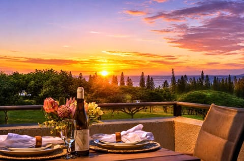 Sweeping sunset view over the Kapalua coastline, with the fairways and Pacific visible from your villa.