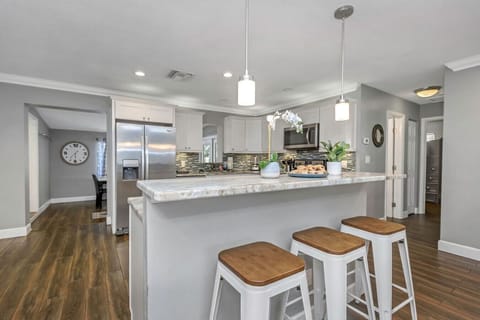 Share coffee, snacks, or happy hour drinks around the inviting island counter.